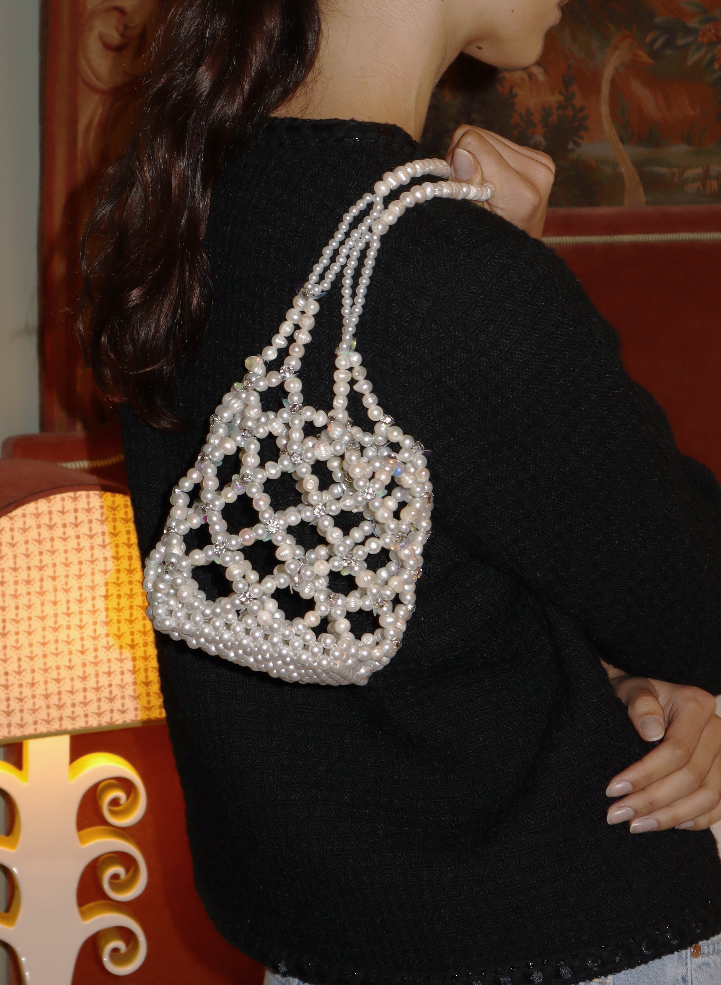 Close-up editorial of Sunday’s Best pearl and crystal shoulder bag